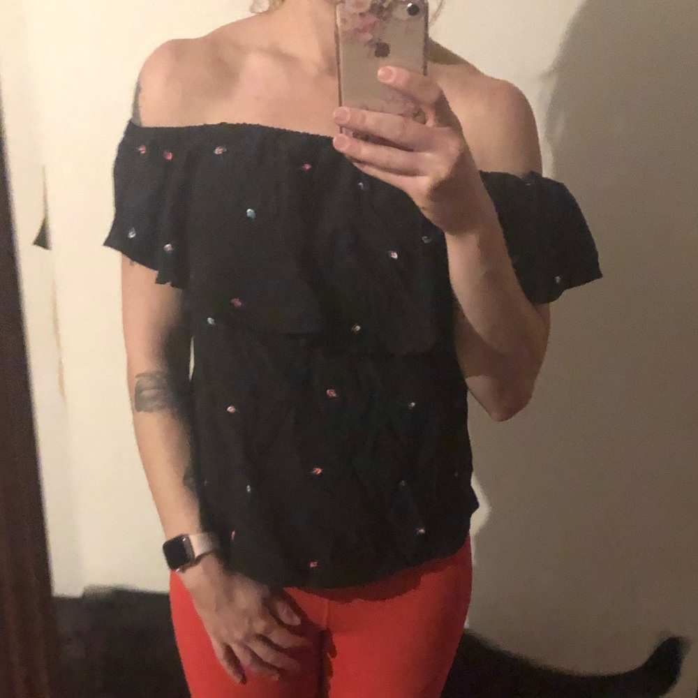 Ruffled black over the shoulder shirt